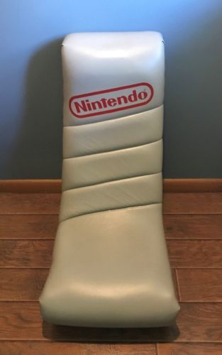 Gray low rocker gaming chair with Nintendo logo on it